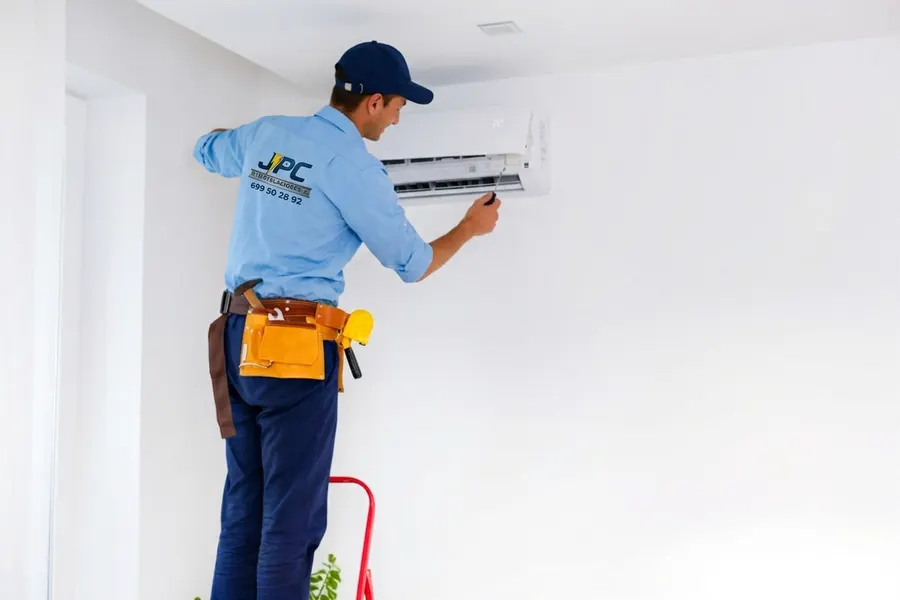 Air conditioning capacity and unit position Installer checking the position and capacity of a split air conditioner